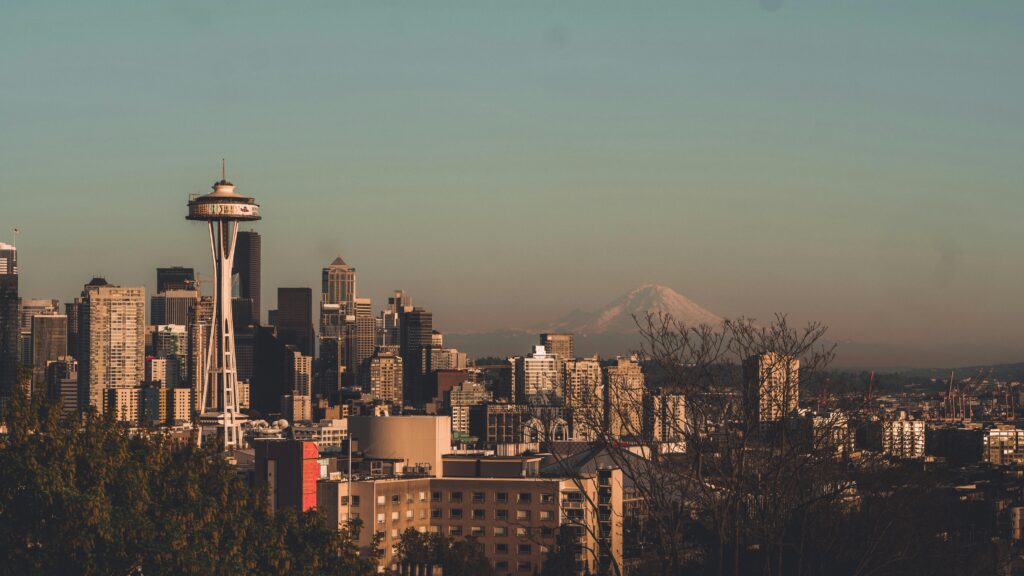 pexels-photo-1796730-1796730 Stunning view of Seattle's skyline featuring the Space Needle with Mount Rainier in the background.